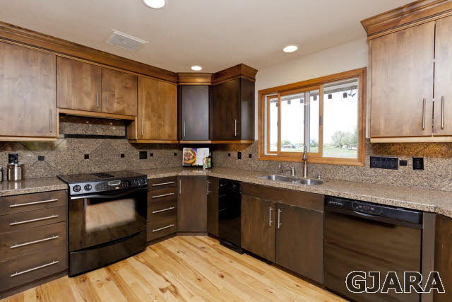 2638 H Road Grand Junction, CO 81506 - Photo 11 of 36 a kitchen with a sink stove and cabinets