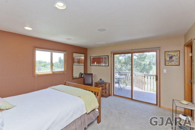 2638 H Road Grand Junction, CO 81506 - Photo 15 of 36 a bedroom with a large bed and a large window