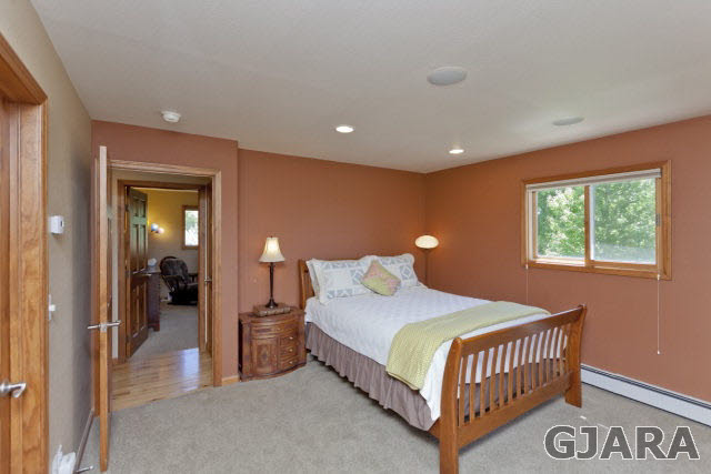 2638 H Road Grand Junction, CO 81506 - Photo 16 of 36 a bedroom with a bed and a lamp