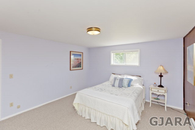 2638 H Road Grand Junction, CO 81506 - Photo 23 of 36 a bedroom with a bed and a table