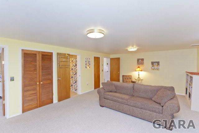 2638 H Road Grand Junction, CO 81506 - Photo 26 of 36 a living room with furniture a lamp and a closet