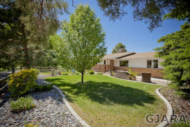 2638 H Road Grand Junction, CO 81506 - Photo 30 of 36 a front view of a house with garden
