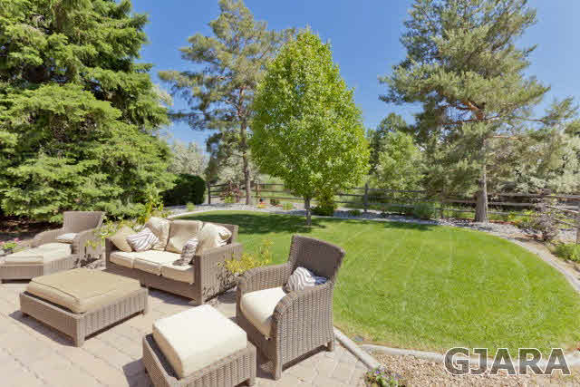 2638 H Road Grand Junction, CO 81506 - Photo 32 of 36 a view of a swimming pool and lounge chairs in back of a house