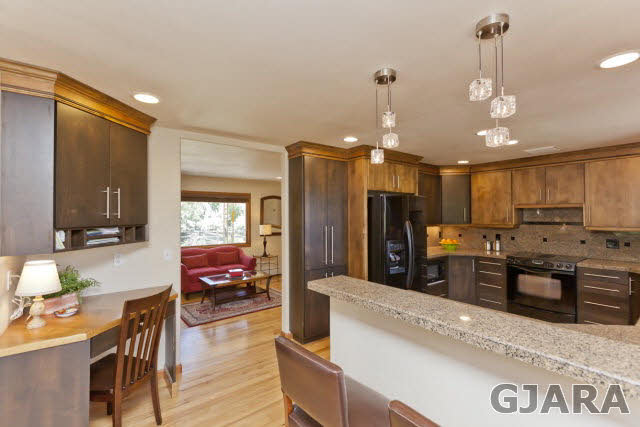 2638 H Road Grand Junction, CO 81506 - Photo 9 of 36 a large kitchen with kitchen island a large island in it
