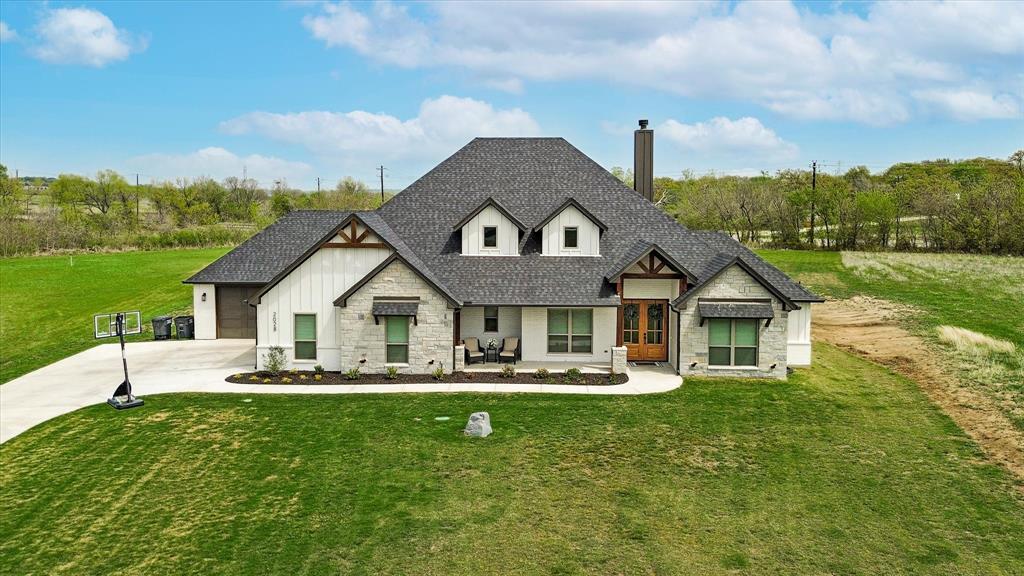 a front view of a house with garden
