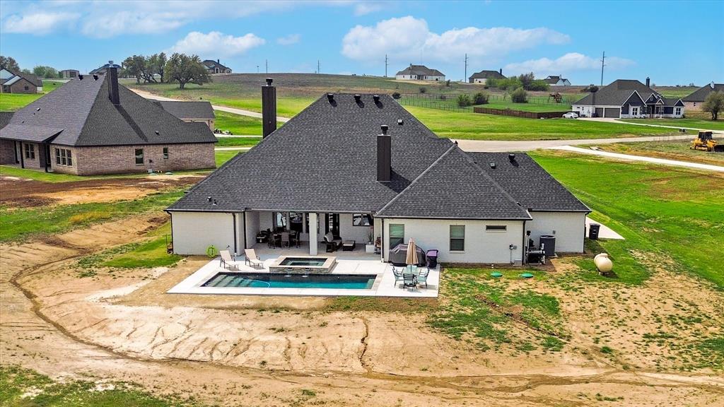 2028 Carrie Court Weatherford, TX 76088 - Photo 2 of 40 a front view of a house with garden