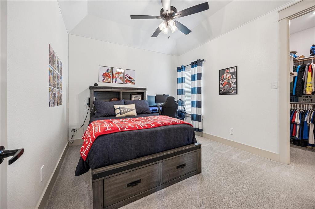 2028 Carrie Court Weatherford, TX 76088 - Photo 26 of 40 a bedroom with a bed and furniture