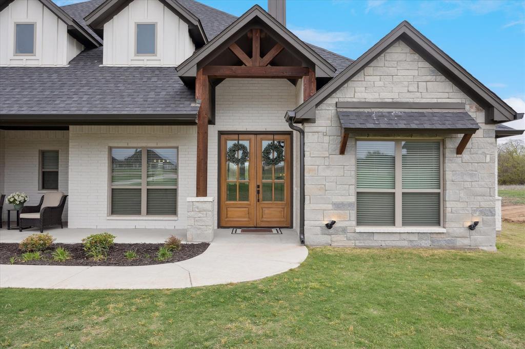 2028 Carrie Court Weatherford, TX 76088 - Photo 5 of 40 a front view of a house with garden