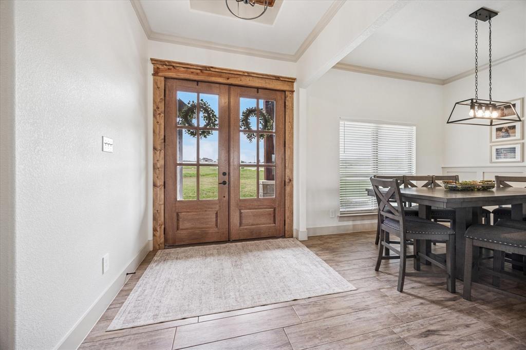 2028 Carrie Court Weatherford, TX 76088 - Photo 6 of 40 a view of a livingroom with furniture window and wooden floor