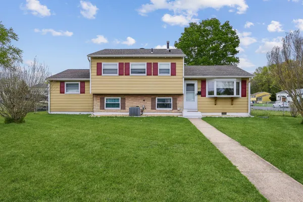 a view of a house with a big yard