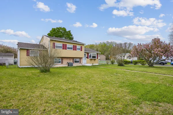 a view of a house with a big yard