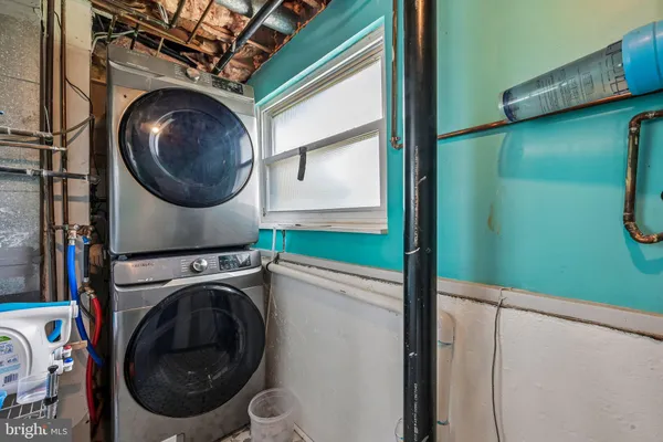 a view of a hallway with washer and dryer