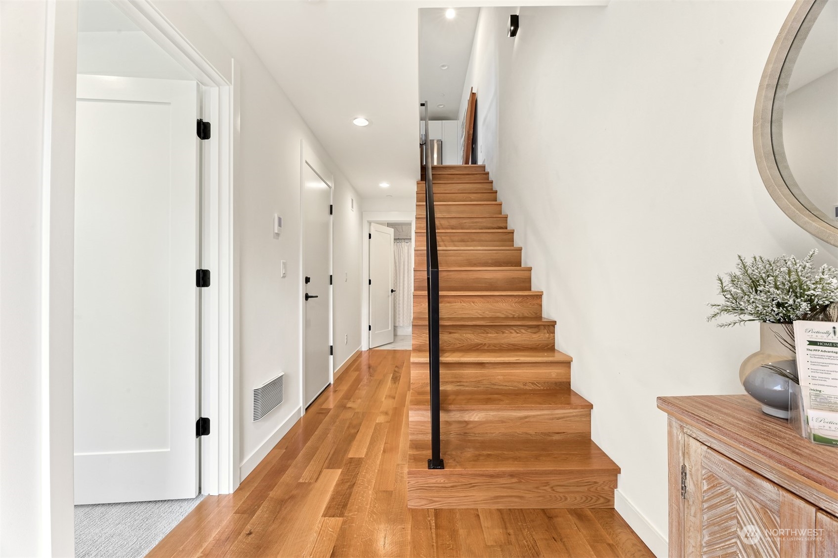 422 14th Avenue East, Unit B Seattle, WA 98112 - Photo 12 of 24 a view of a hallway with wooden floor and staircase