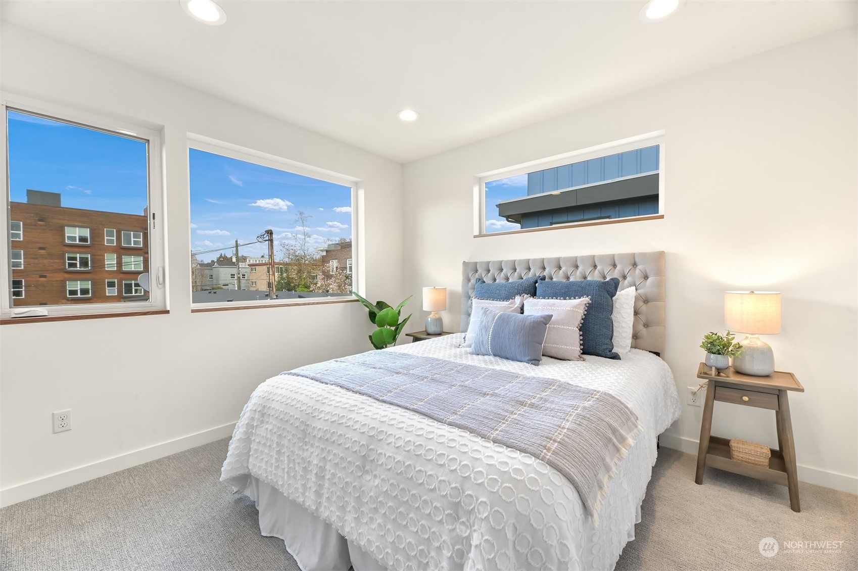 422 14th Avenue East, Unit B Seattle, WA 98112 - Photo 13 of 24 a bedroom with a large bed and a window