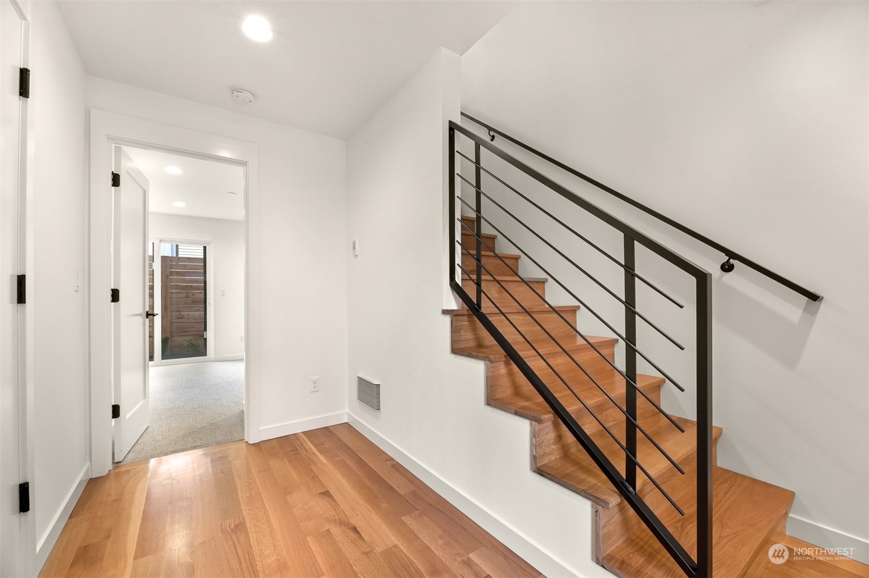 422 14th Avenue East, Unit B Seattle, WA 98112 - Photo 15 of 24 a view of an entryway with wooden floor and stairs