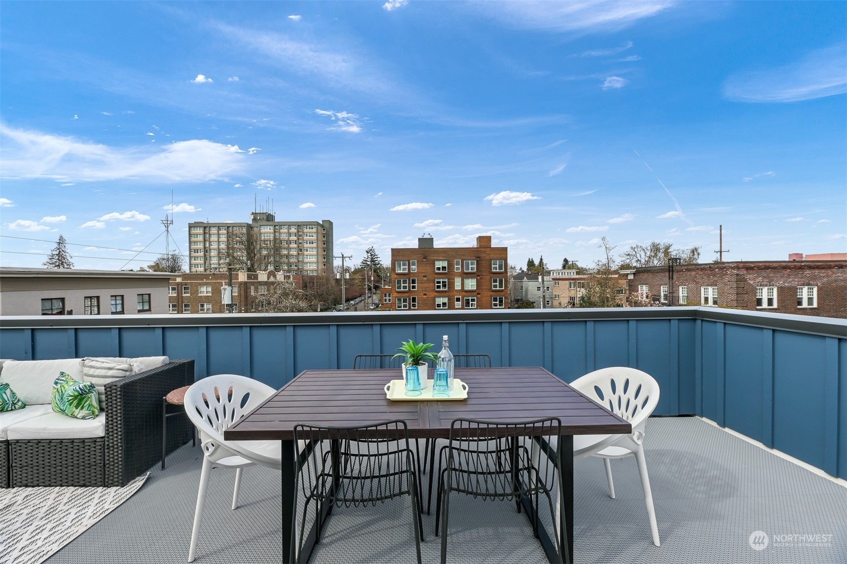 422 14th Avenue East, Unit B Seattle, WA 98112 - Photo 23 of 24 a view of a balcony with table and chairs