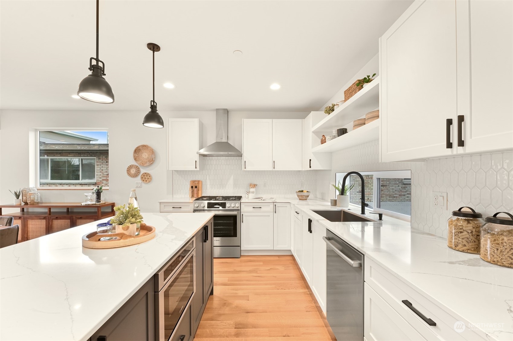 422 14th Avenue East, Unit B Seattle, WA 98112 - Photo 8 of 24 a kitchen with a sink stove and wooden floor