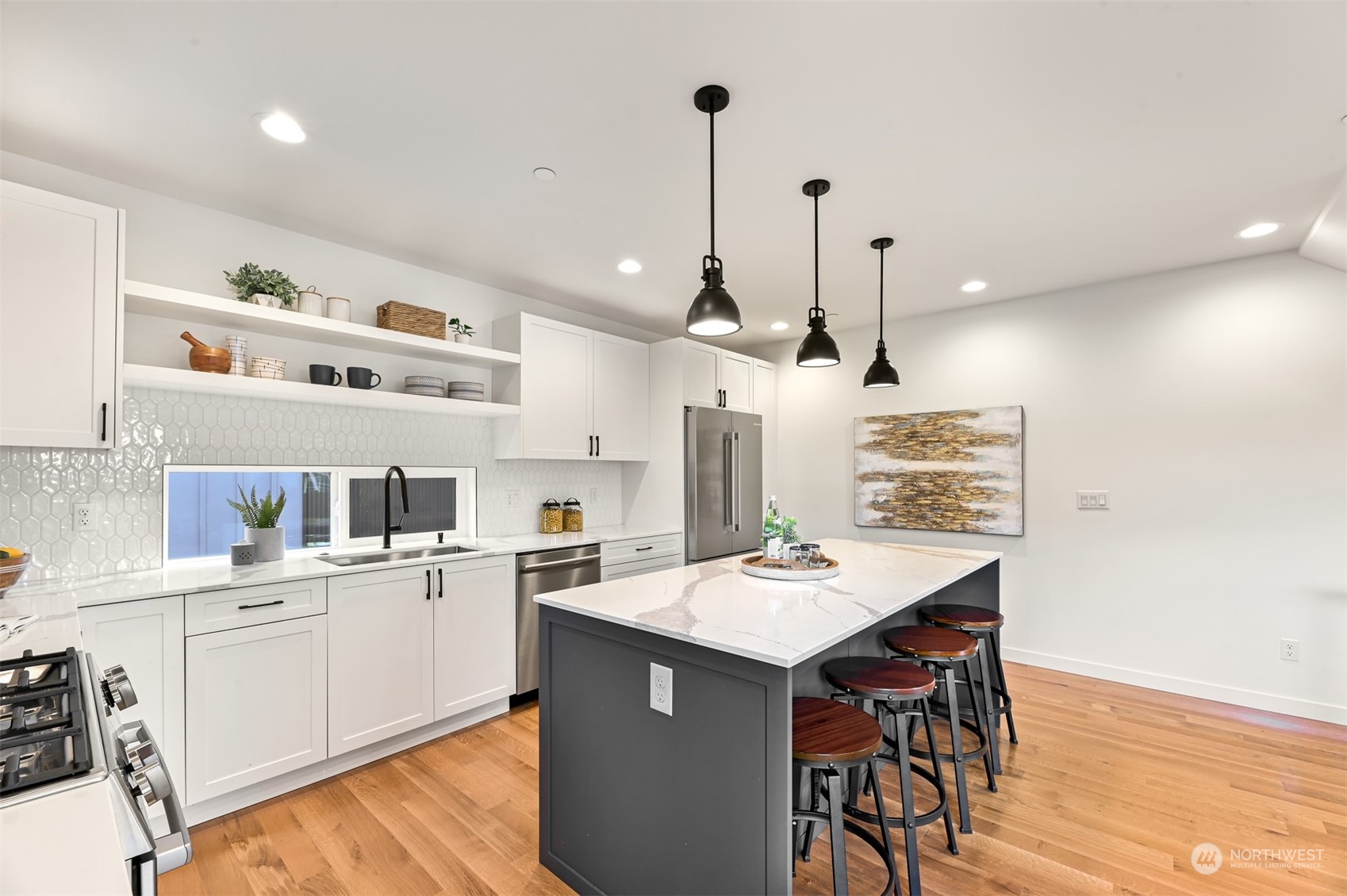 422 14th Avenue East, Unit B Seattle, WA 98112 - Photo 9 of 24 a kitchen with a sink a counter space appliances and cabinets