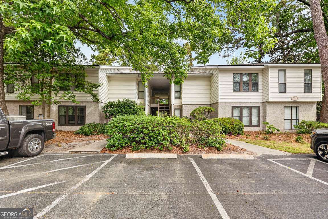 2514 Demere Road, Unit 7 St. Simons, GA 31522 - Photo 2 of 22 front view of a house with a street