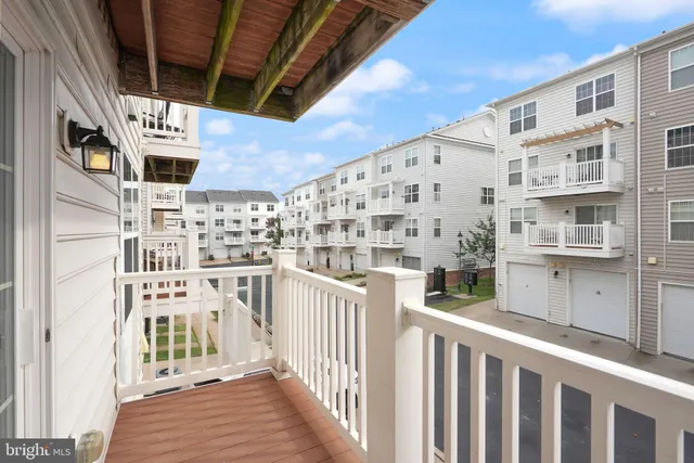 a view of a balcony with wooden fence
