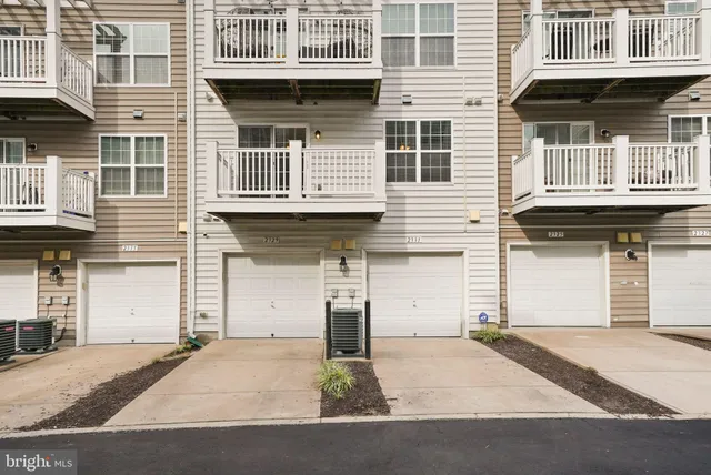 a front view of a house with a garage