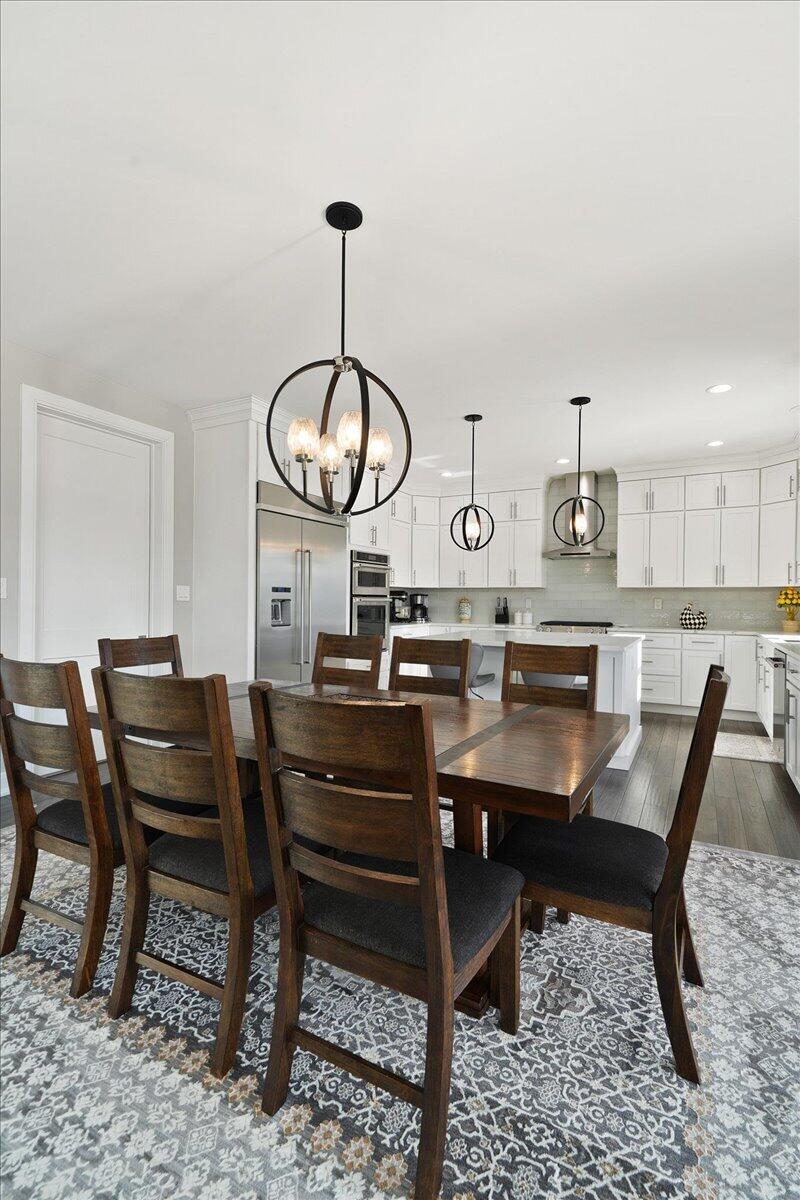 9317 Michigan Drive Crown Point, IN 46307 - Photo 12 of 42 a view of a dining room and chairs