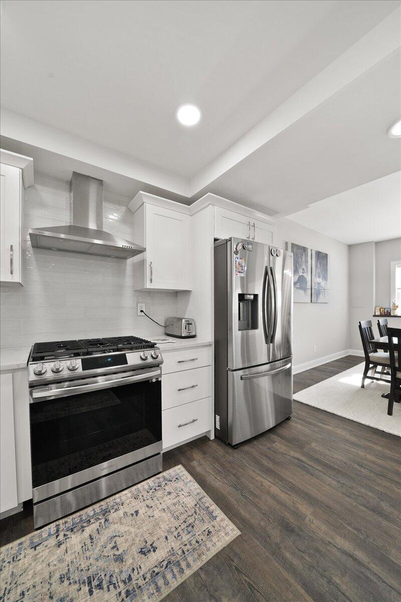 9317 Michigan Drive Crown Point, IN 46307 - Photo 26 of 42 a kitchen with a stove a refrigerator and a stove