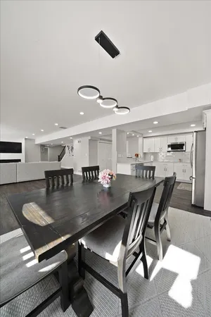 a kitchen with a white stove top oven and white cabinets