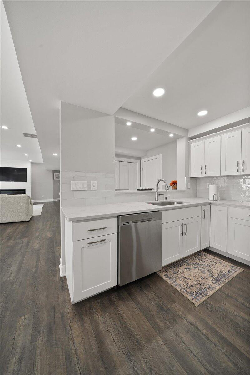 9317 Michigan Drive Crown Point, IN 46307 - Photo 28 of 42 a kitchen with a white stove top oven and white cabinets