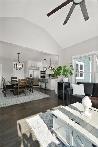 a living room with furniture potted plant and a window