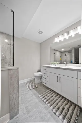 a living room with hard wood floors and a ceiling fan