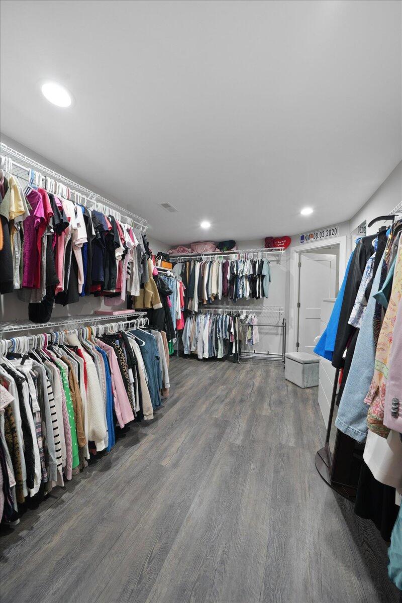 9317 Michigan Drive Crown Point, IN 46307 - Photo 34 of 42 a view of a living room with clothes and shoes