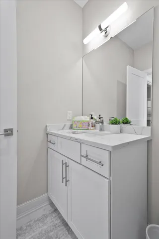 a kitchen with a sink a stove and cabinets