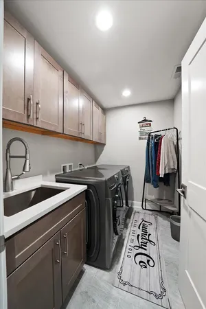 a room with a bed and a dresser
