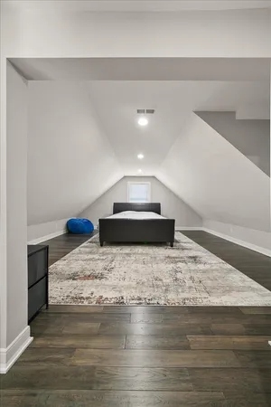 a spacious bathroom with a sink a toilet and a shower