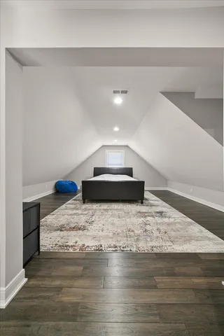 a spacious bathroom with a sink a toilet and a shower