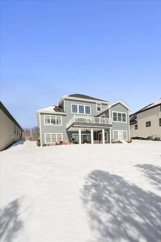 a front view of a house with a street