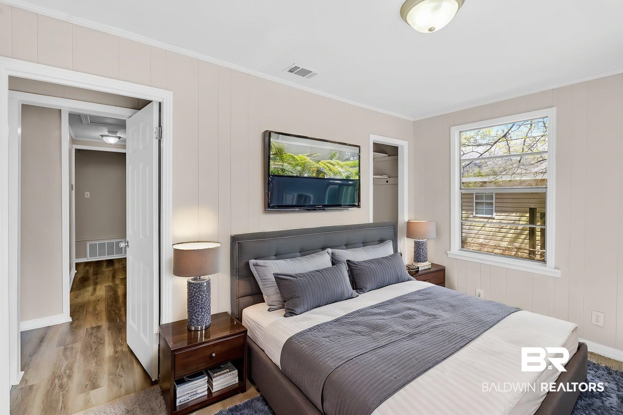66 11th Avenue Chickasaw, AL 36611 - Photo 10 of 15 Bedroom with visible vents, crown molding, and wood finished floors