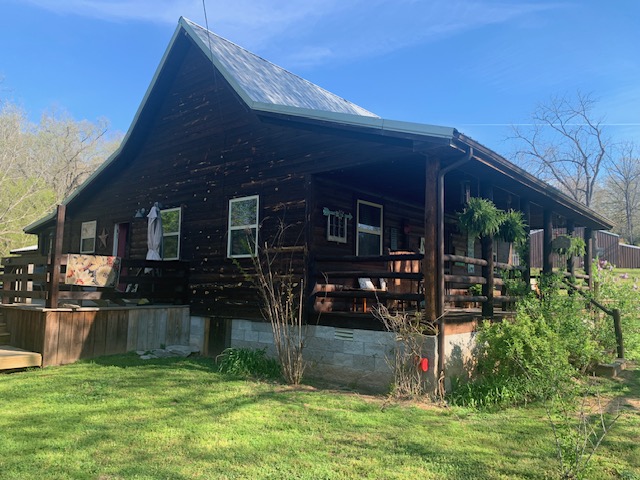 2026 Dry Creek Road St. Joe, AR 72675 - Photo 3 of 60 Log cabin exterior with a gambrel roof and an expansive covered porch
