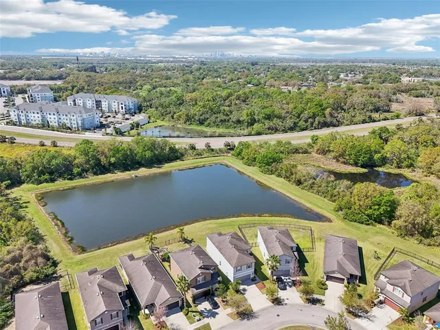 an aerial view of a residential houses with outdoor space
