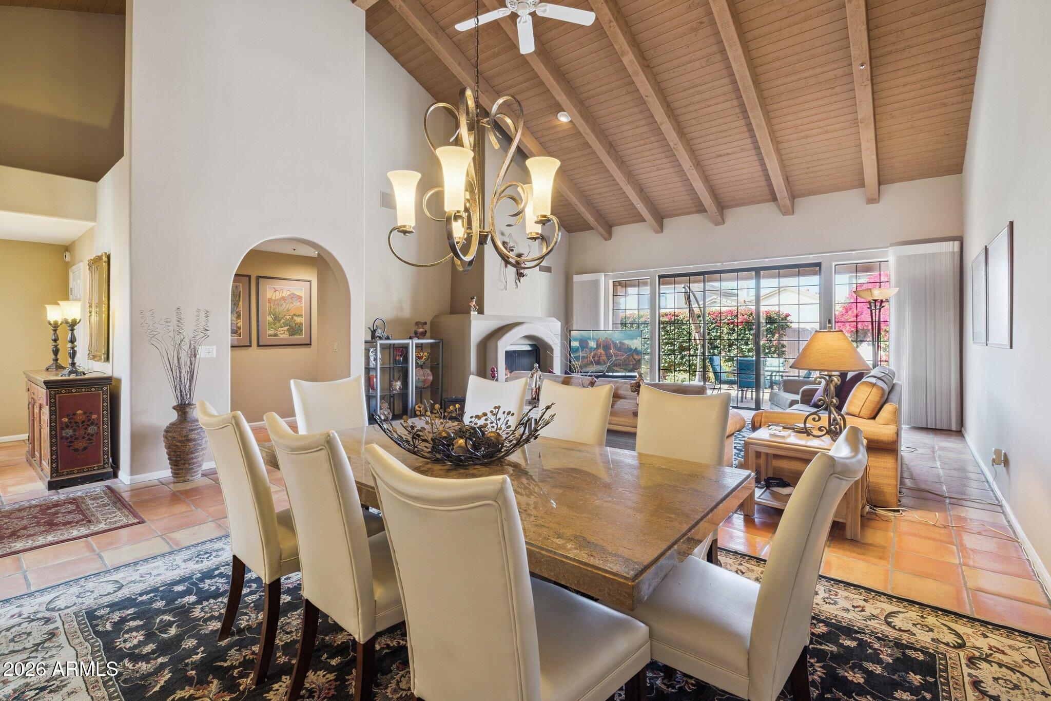 8100 East Camelback Road, Unit 129 Scottsdale, AZ 85251 - Photo 2 of 13 a dining room with furniture a chandelier and wooden floor