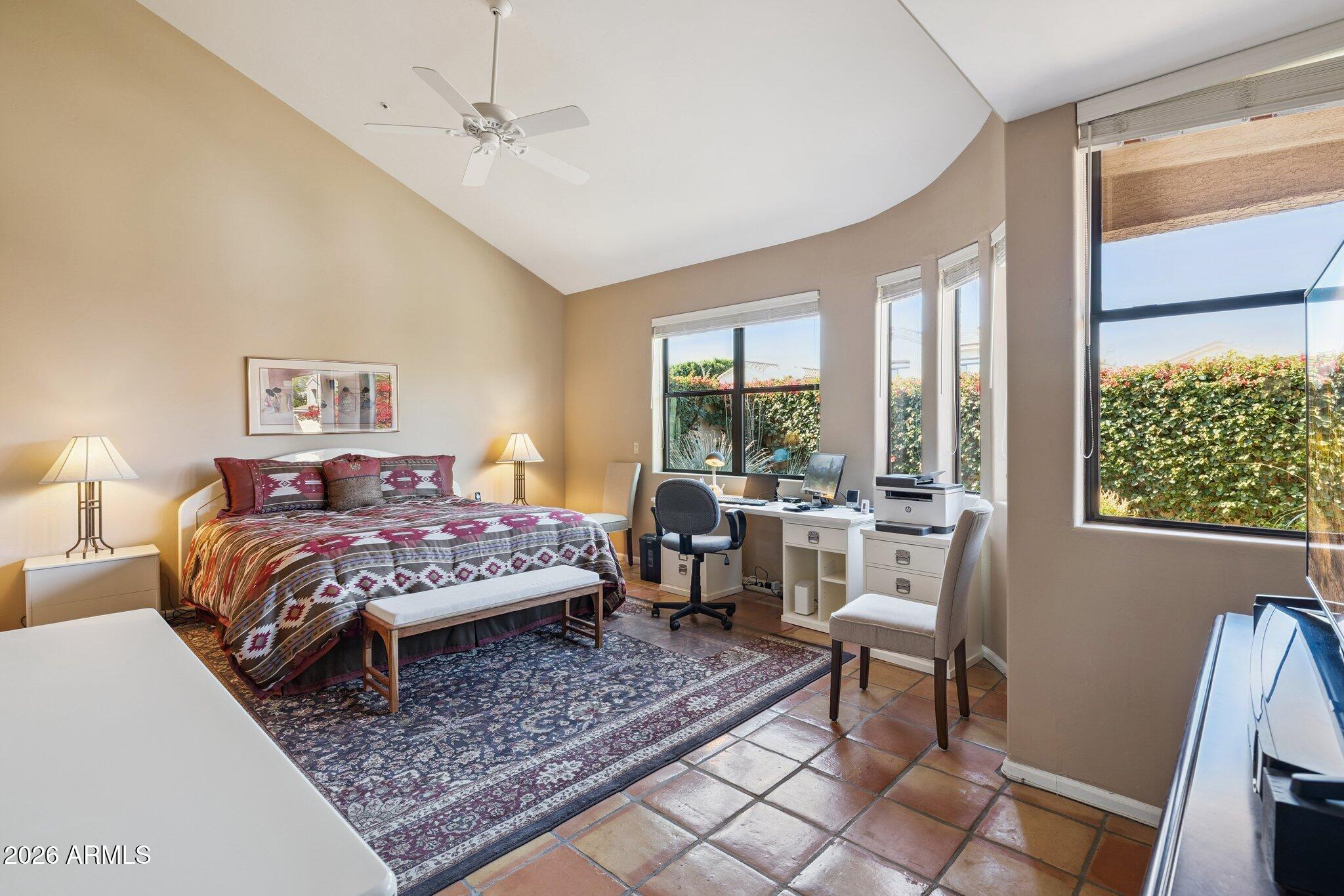 8100 East Camelback Road, Unit 129 Scottsdale, AZ 85251 - Photo 5 of 13 a bed room with a bed and a chair