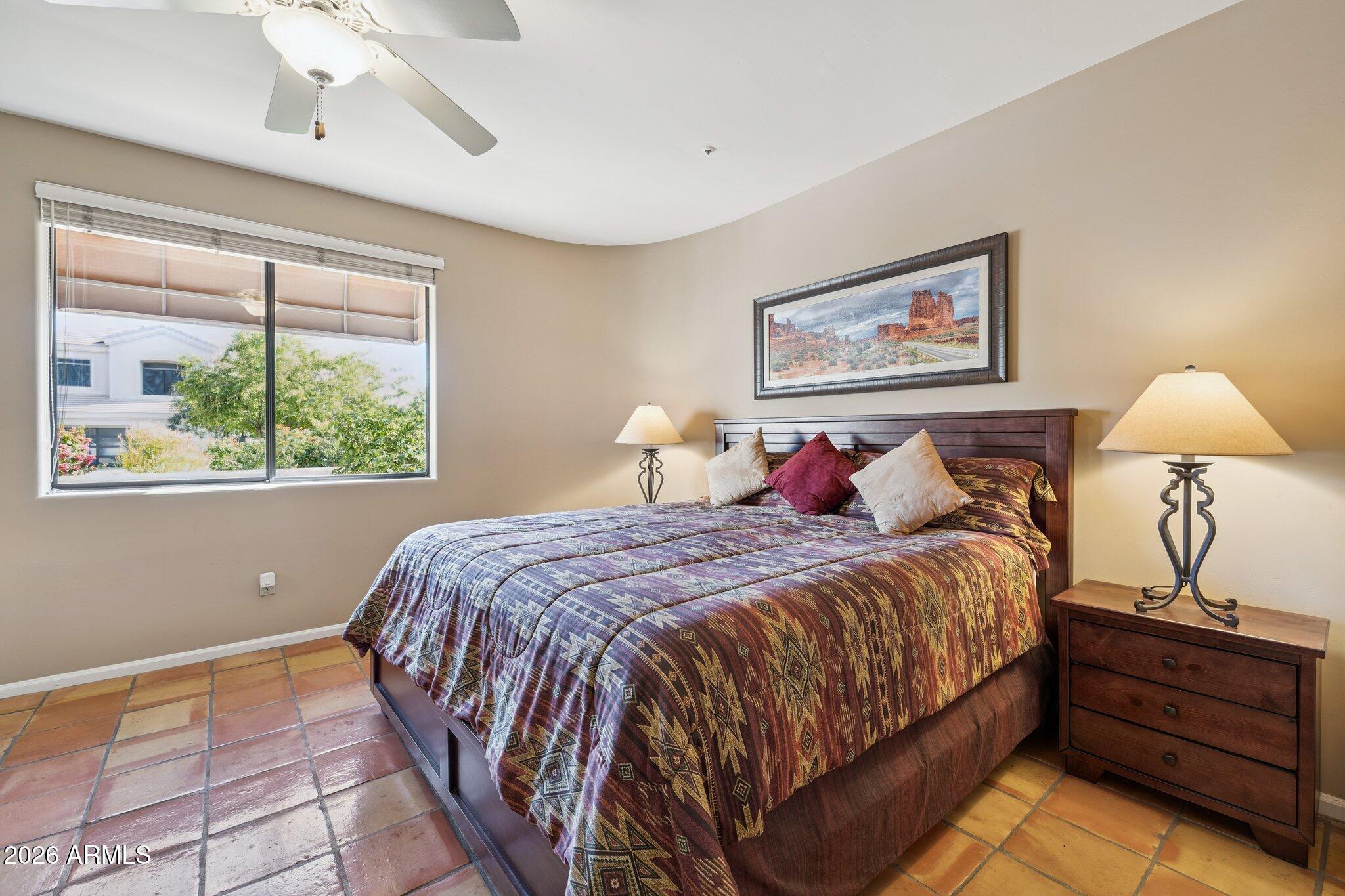 8100 East Camelback Road, Unit 129 Scottsdale, AZ 85251 - Photo 7 of 13 a bed room with a bed and a window
