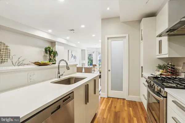 a living room with furniture and large windows