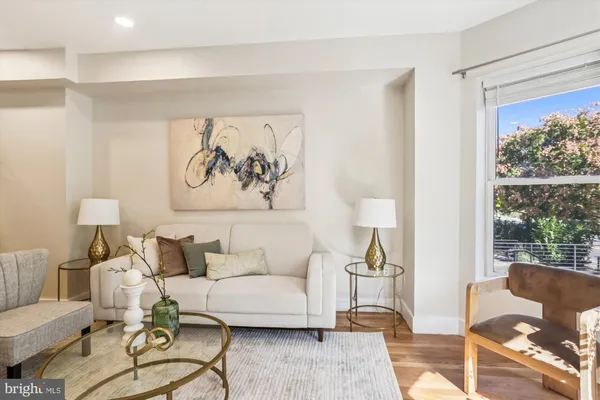 a living room with furniture or couch and a table