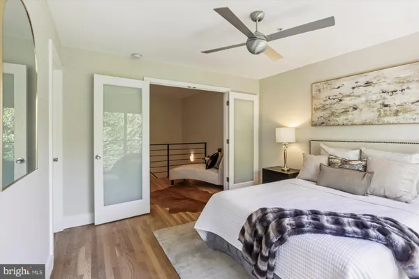 a bedroom with a large bed and a window