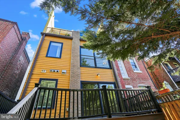 a view of a backyard with tree