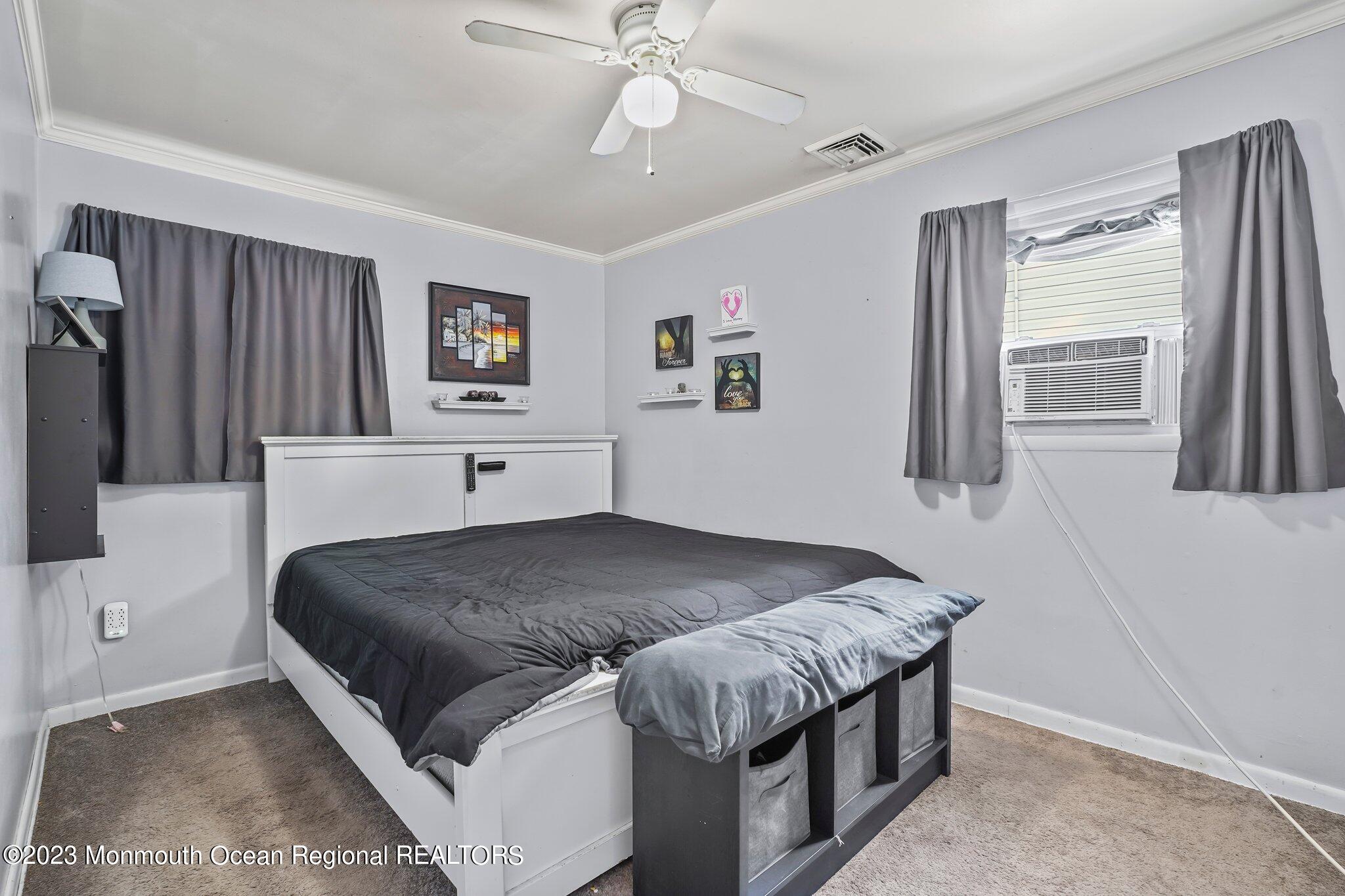 819 Shore Concourse Keyport, NJ 07735 - Photo 14 of 26 a living room with a bed furniture and a window