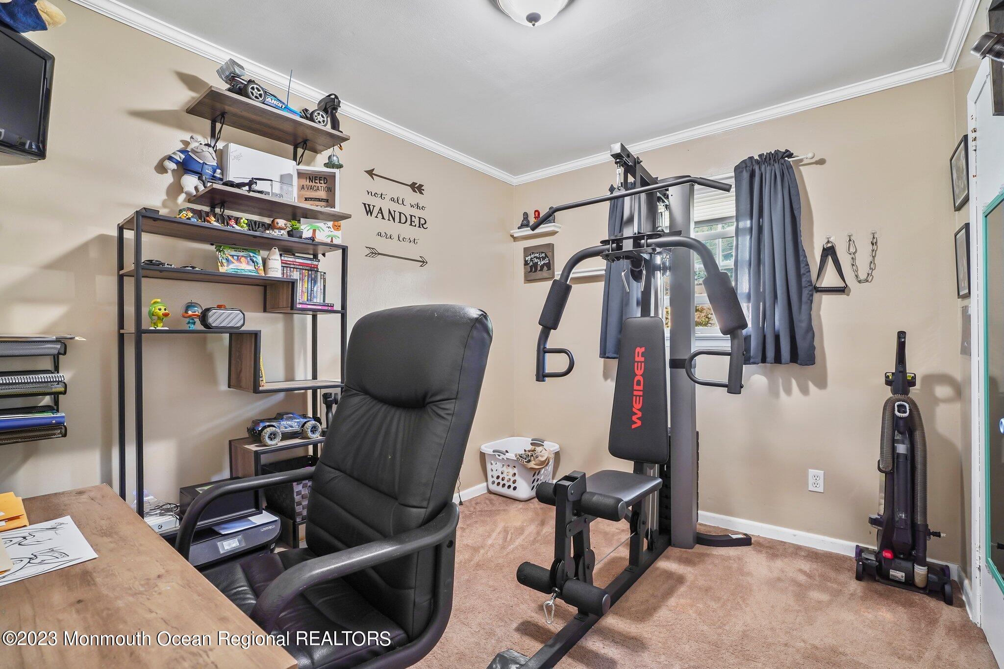 819 Shore Concourse Keyport, NJ 07735 - Photo 17 of 26 a room with gym equipment and a mirror