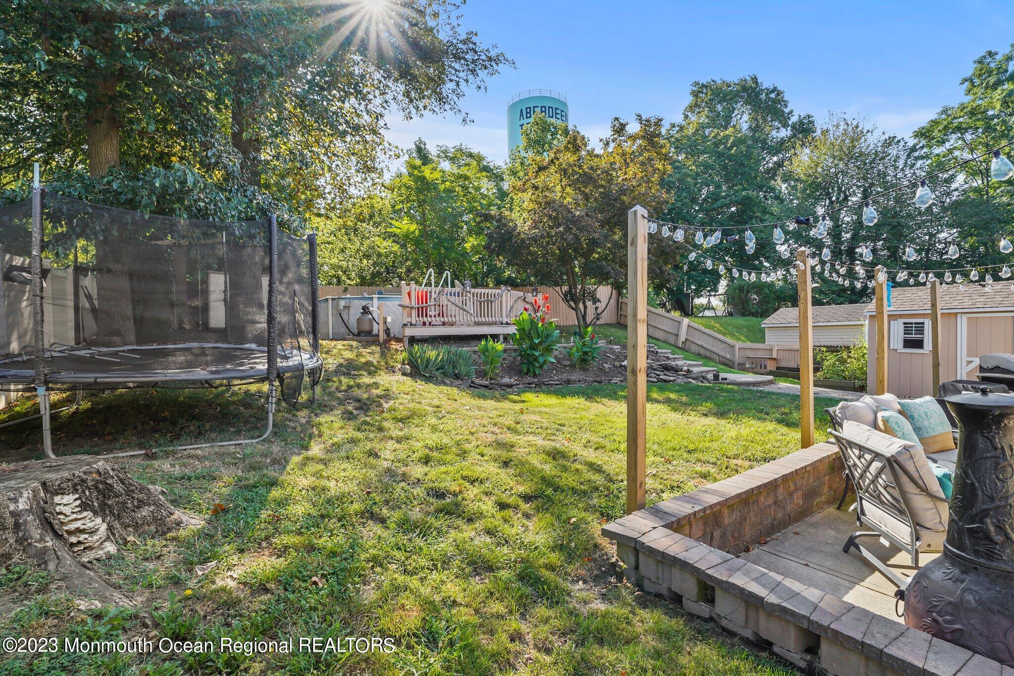 819 Shore Concourse Keyport, NJ 07735 - Photo 24 of 26 a view of a garden with a slide